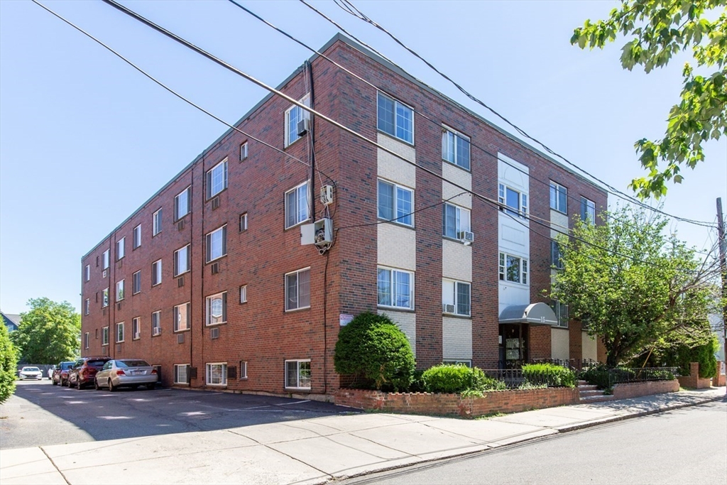 15 Staples Avenue, Unit 46 Everett, MA 02149 - Photo 32 of 35 a view of a building with a street