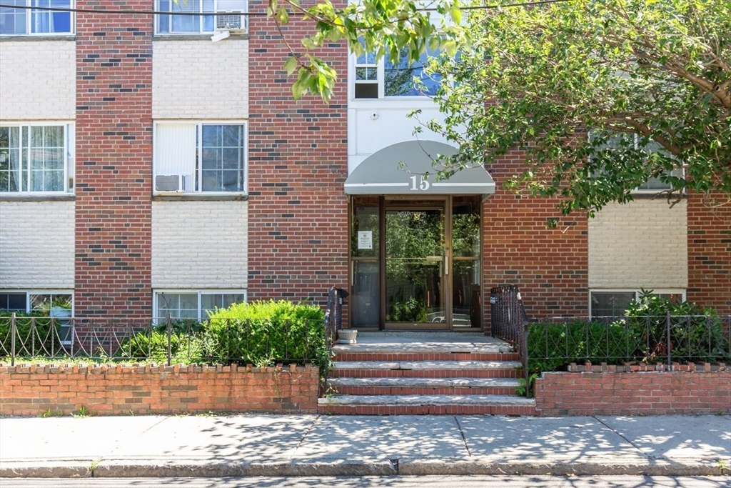 15 Staples Avenue, Unit 46 Everett, MA 02149 - Photo 33 of 35 a front view of a house with garden