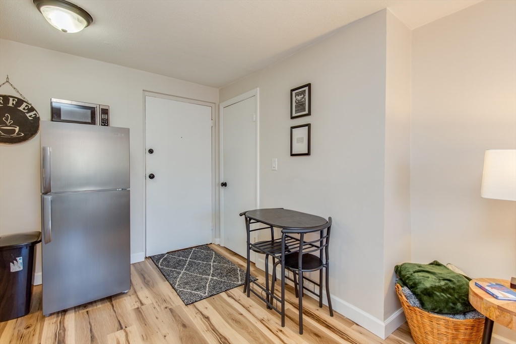 15 Staples Avenue, Unit 46 Everett, MA 02149 - Photo 10 of 35 a workspace with furniture and view of kitchen