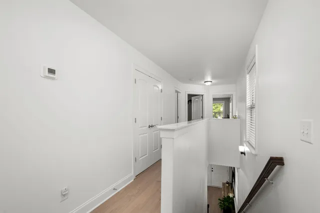 a view of kitchen with furniture and refrigerator