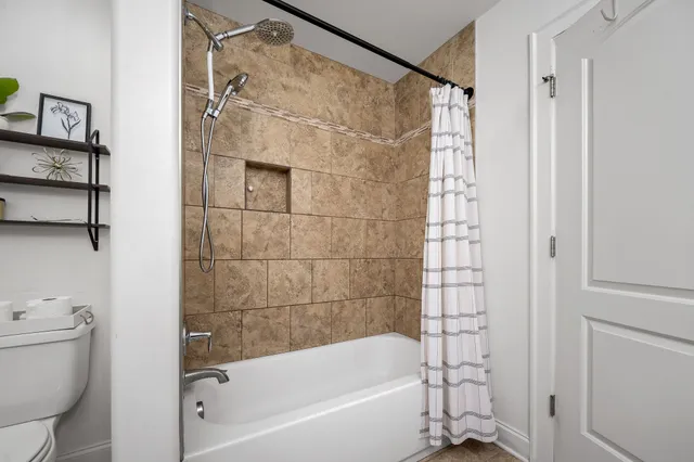 a bedroom with a bed and walk in closet