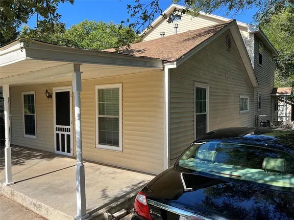 a view of a backyard with sitting area