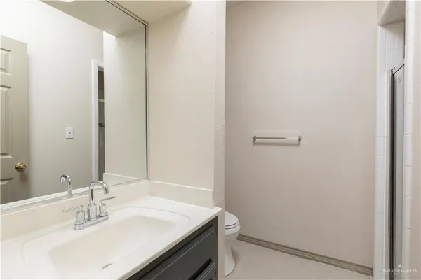 a bathroom with a sink toilet and vanity