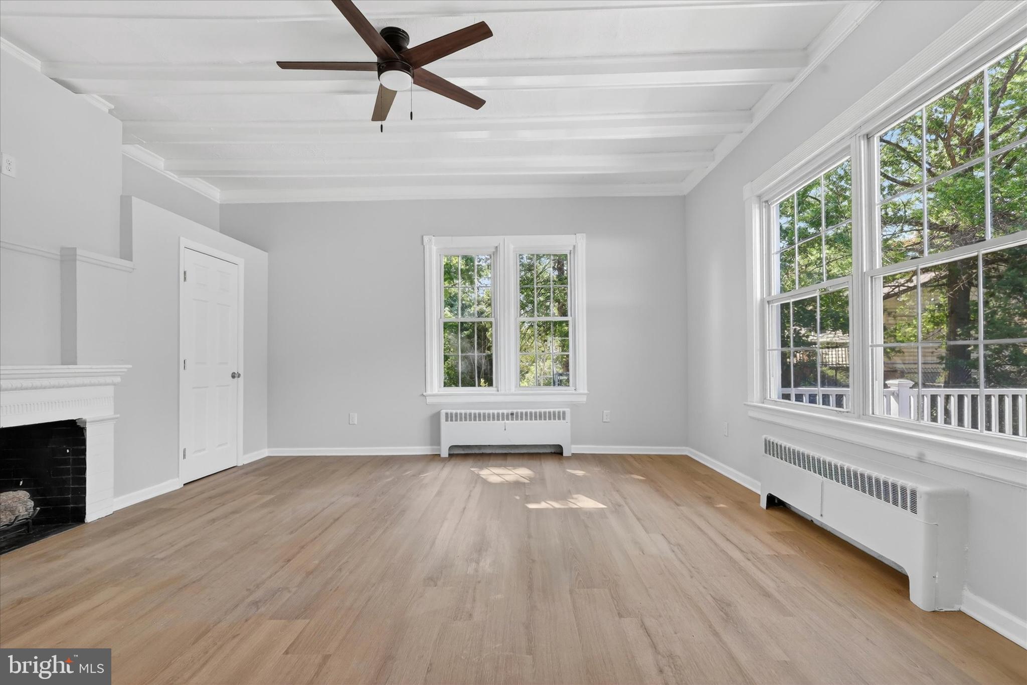 509 Lumberton Road, Unit 1 Hainesport, NJ 08036 - Photo 8 of 33 a view of an empty room with a window and wooden floor