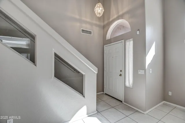 a view of a livingroom with an entryway and a fireplace