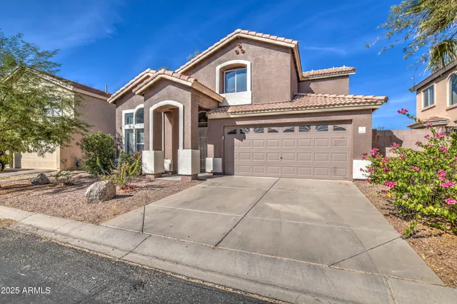 a front view of a house with yard