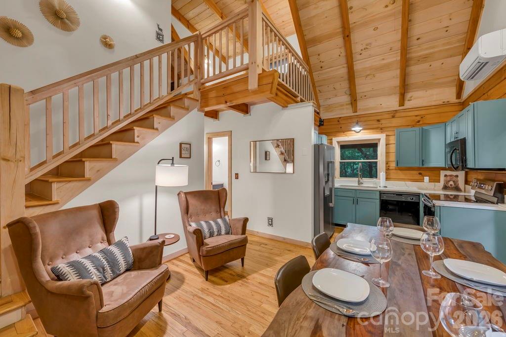 192 Dewitt Barnett Road, Unit 2 Vilas, NC 28692 - Photo 5 of 32 a living room with furniture a fireplace and a ceiling fan