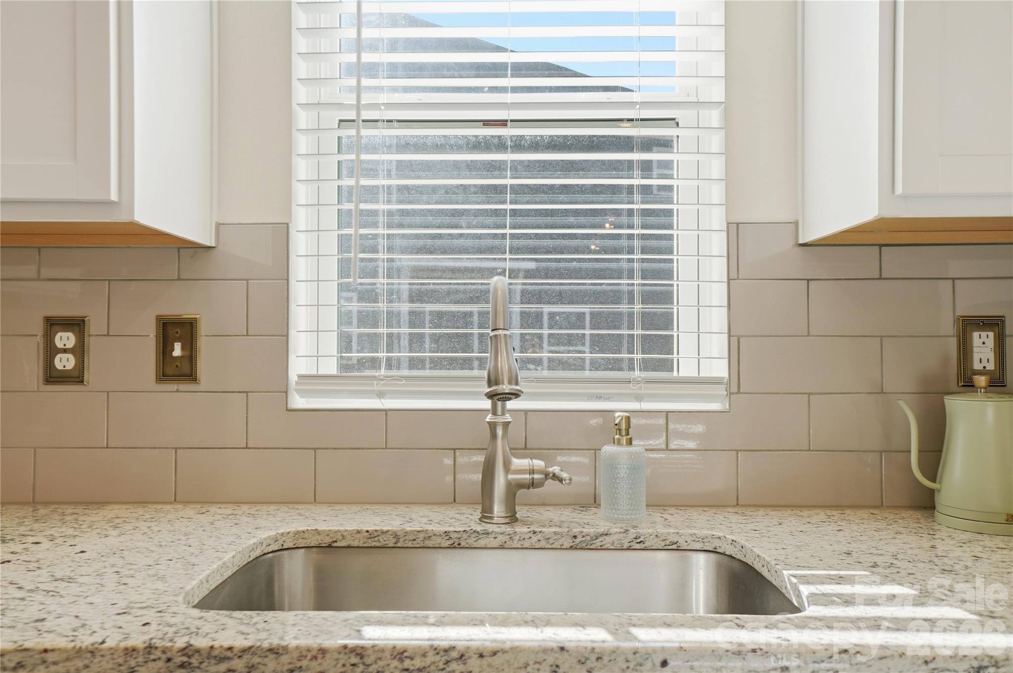 3627 Secrest Landing Monroe, NC 28110 - Photo 12 of 32 a kitchen with a sink and a window