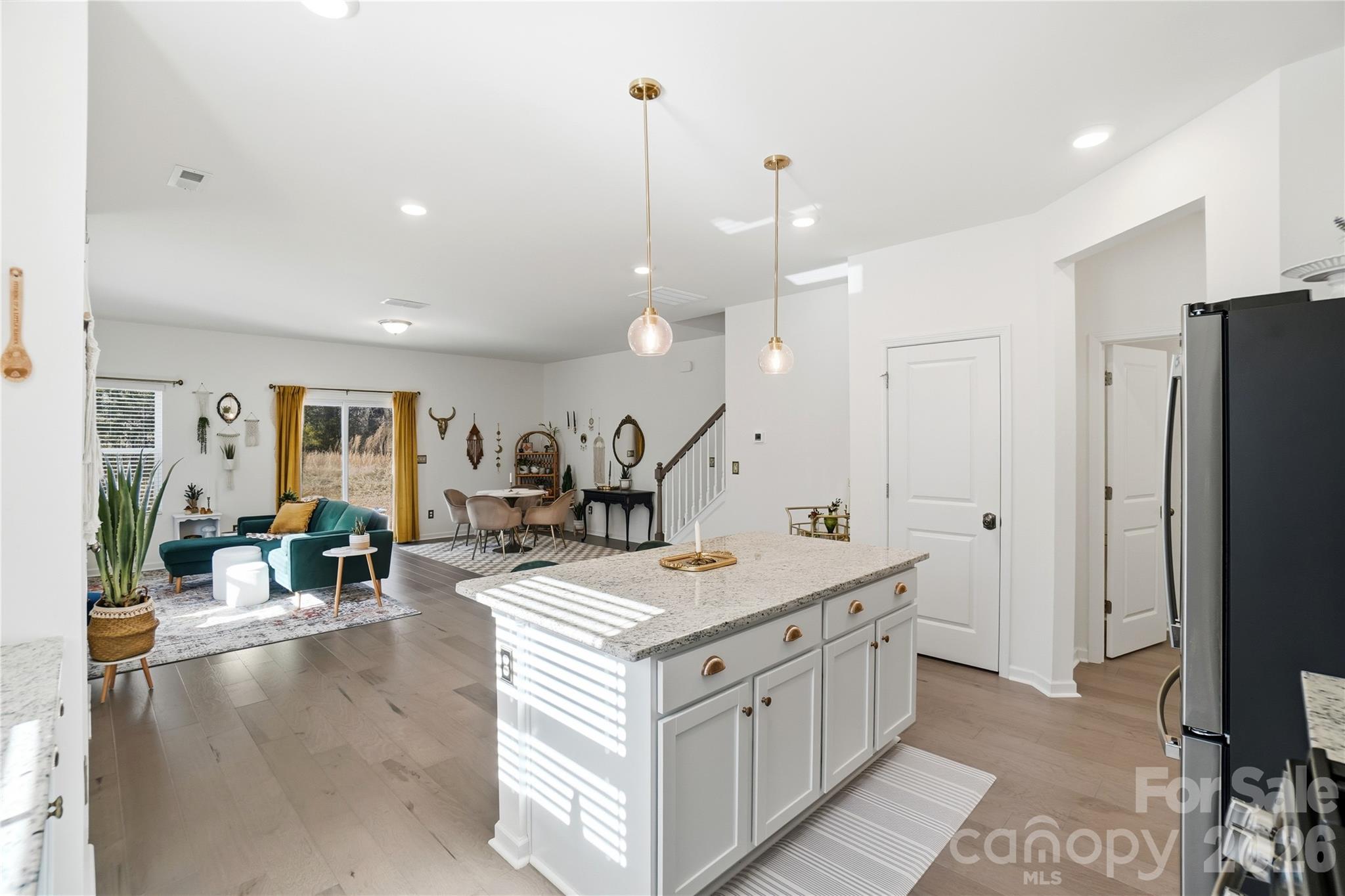 3627 Secrest Landing Monroe, NC 28110 - Photo 13 of 32 a kitchen with stainless steel appliances granite countertop a sink and a refrigerator