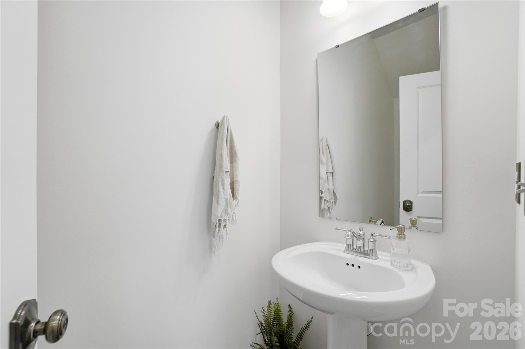 3627 Secrest Landing Monroe, NC 28110 - Photo 14 of 32 a bathroom with a sink and a mirror