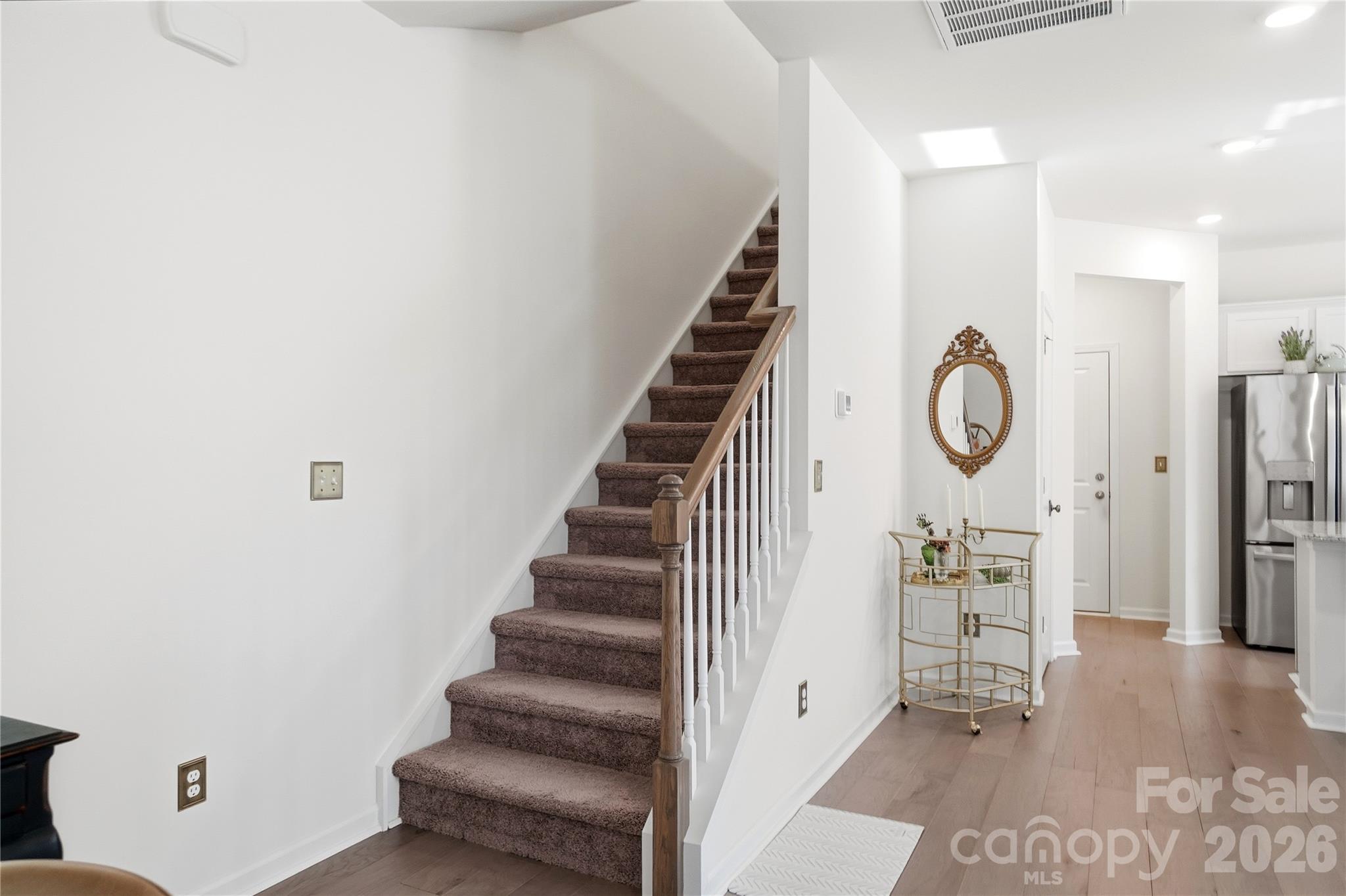 3627 Secrest Landing Monroe, NC 28110 - Photo 15 of 32 a view of a hallway with entryway wooden floor and front door