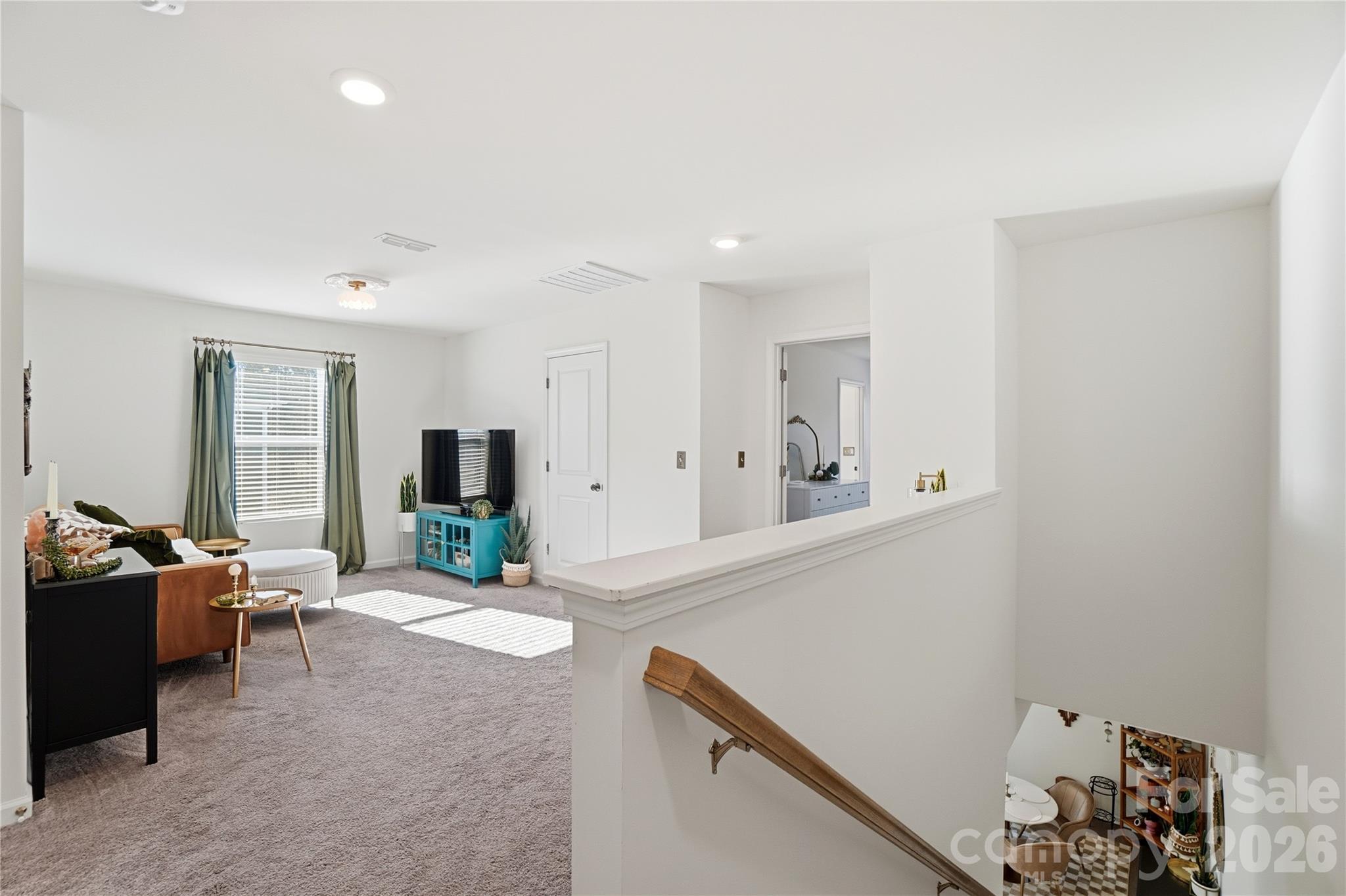 3627 Secrest Landing Monroe, NC 28110 - Photo 16 of 32 a living room with furniture and a flat screen tv