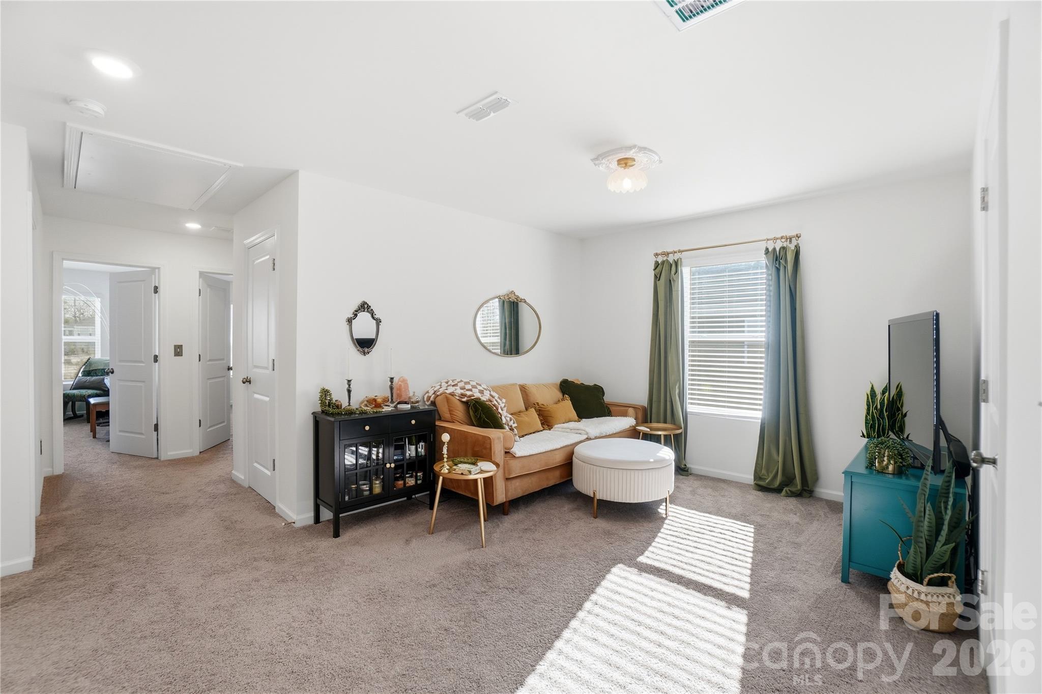 3627 Secrest Landing Monroe, NC 28110 - Photo 17 of 32 a living room with furniture and a potted plant