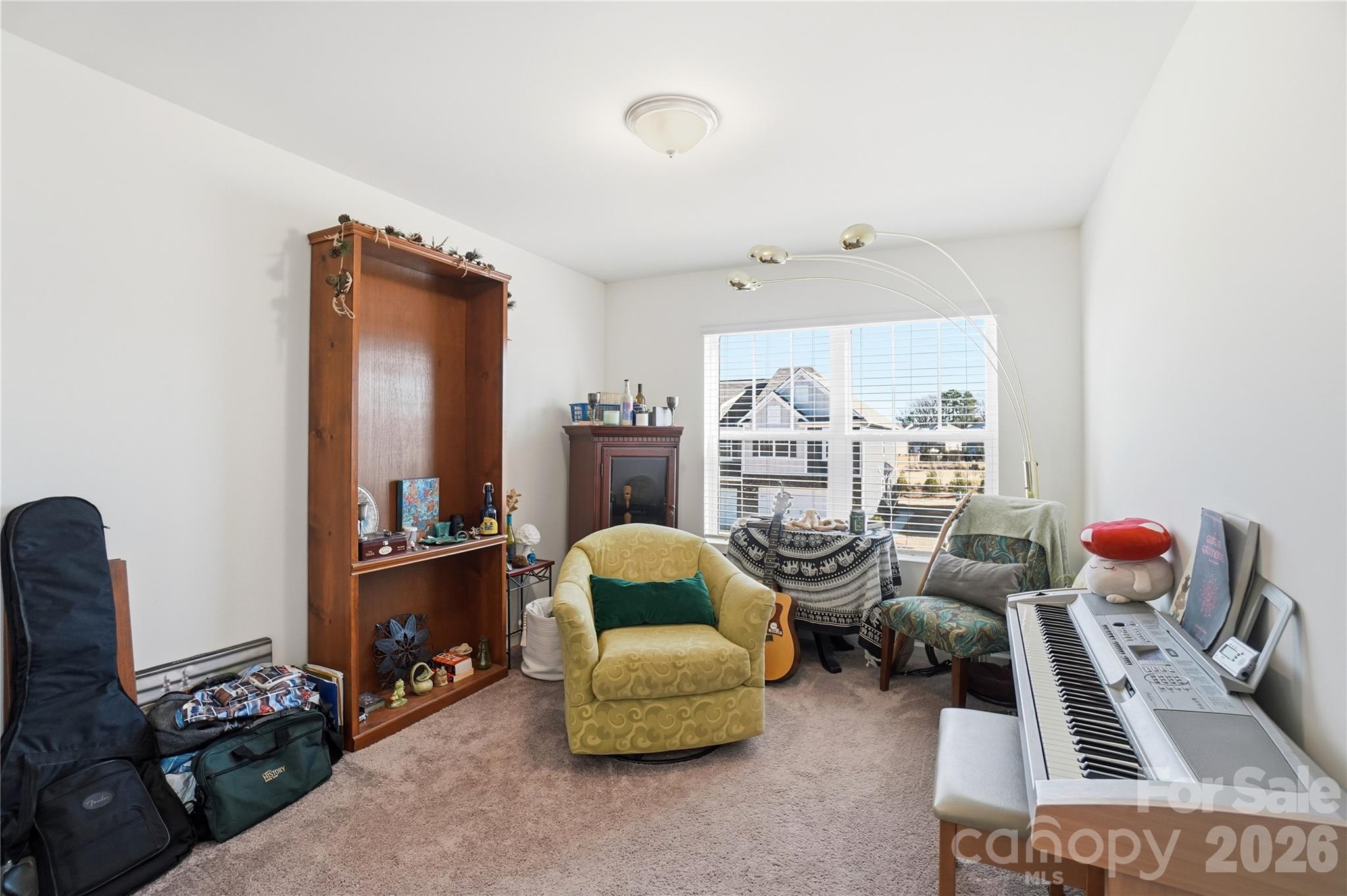 3627 Secrest Landing Monroe, NC 28110 - Photo 22 of 32 a bedroom with furniture and a book shelf