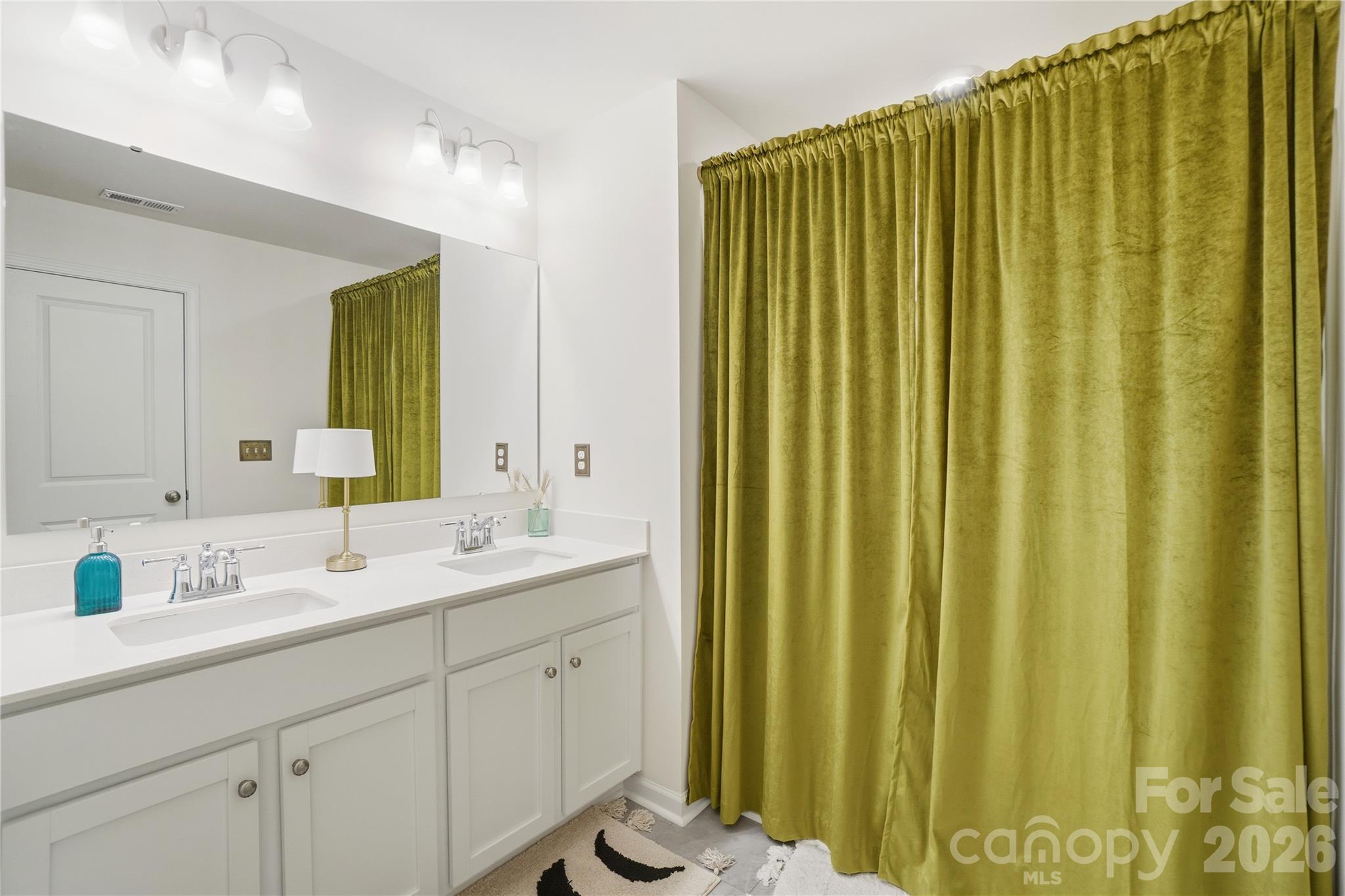 3627 Secrest Landing Monroe, NC 28110 - Photo 24 of 32 a bathroom with a double vanity sink and a mirror