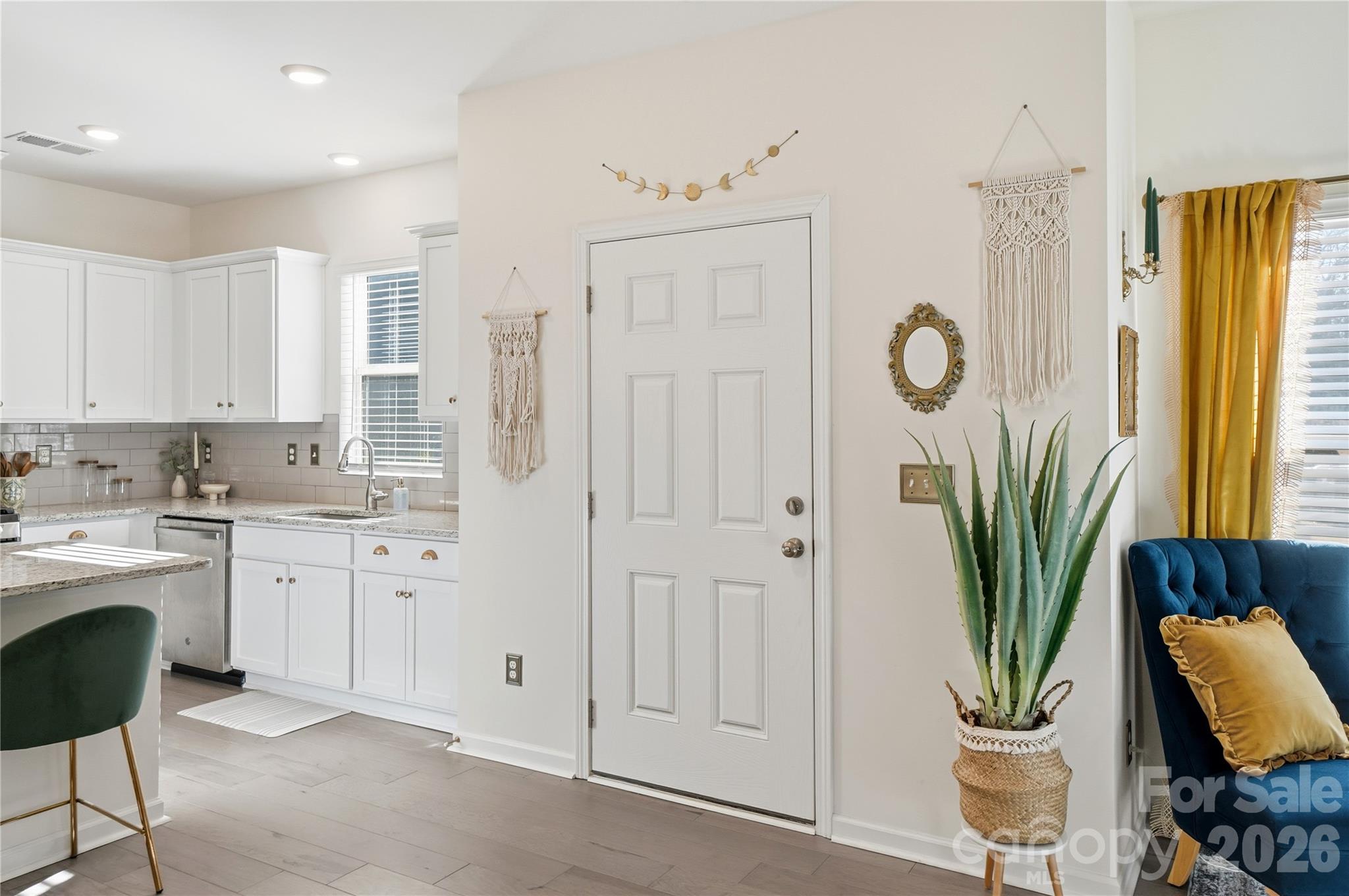 3627 Secrest Landing Monroe, NC 28110 - Photo 4 of 32 a kitchen with white cabinets and outdoor space