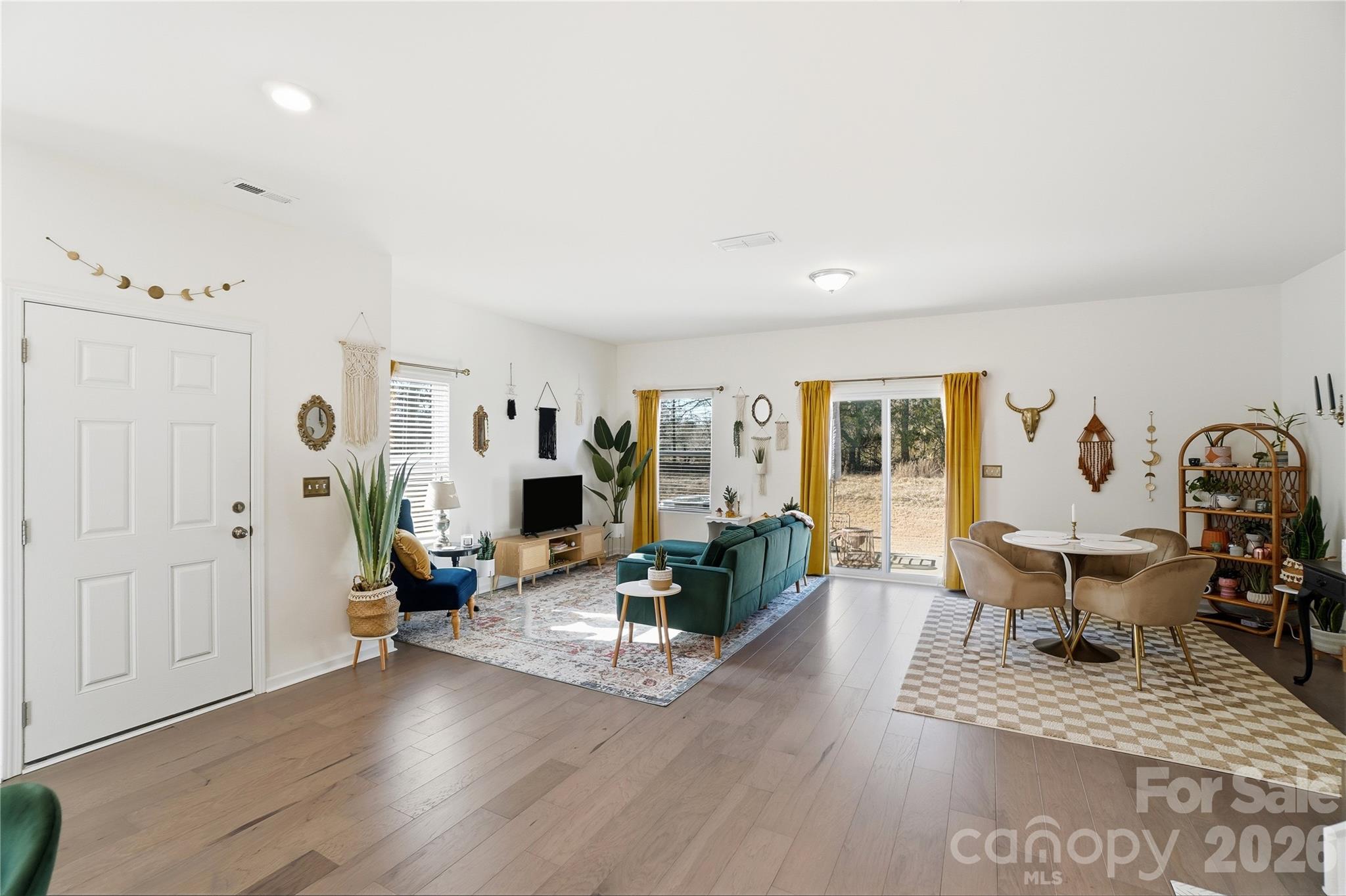 3627 Secrest Landing Monroe, NC 28110 - Photo 5 of 32 a living room with furniture a wooden floor and next to a window