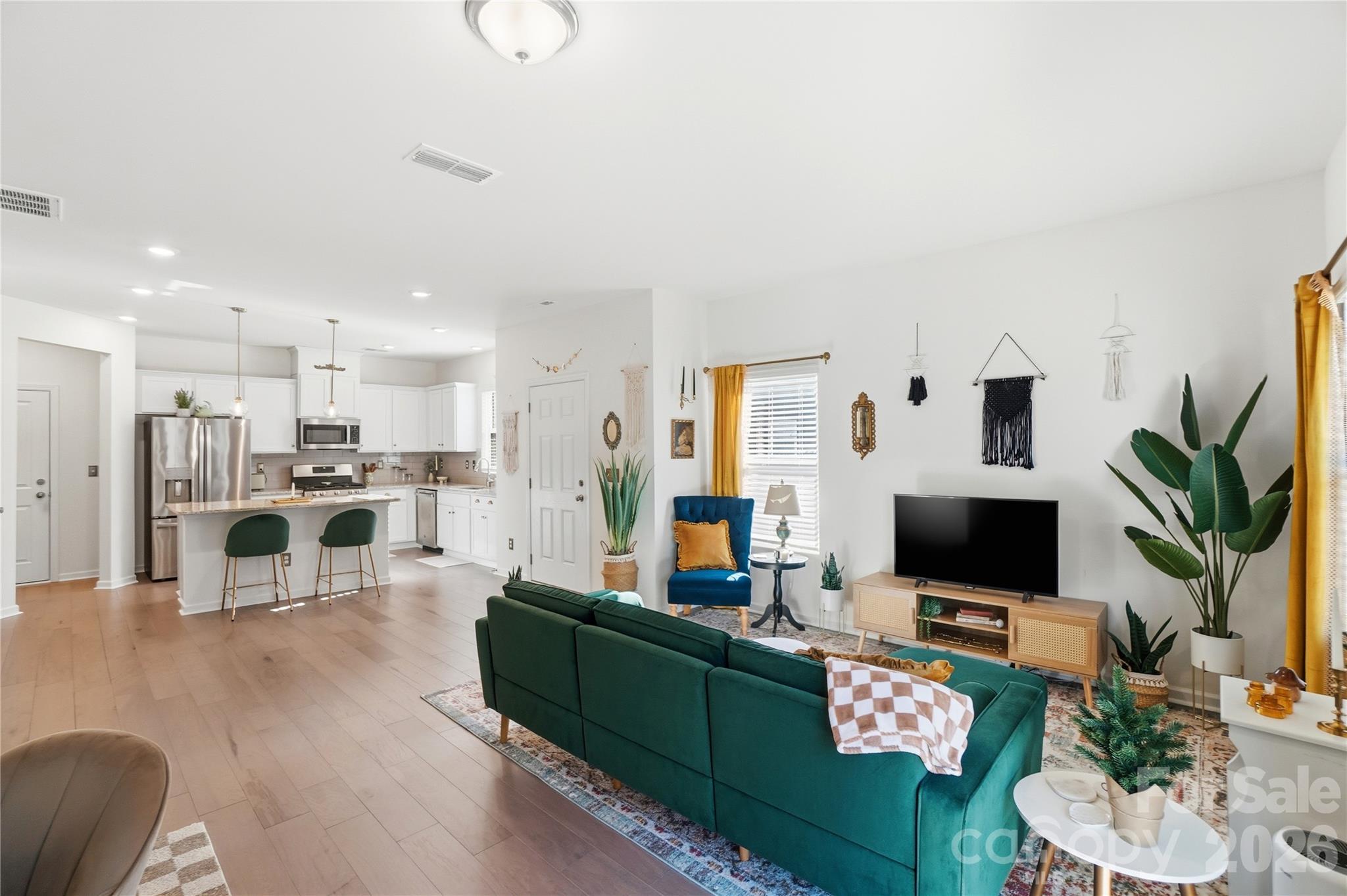 3627 Secrest Landing Monroe, NC 28110 - Photo 7 of 32 a living room with furniture wooden floor and a flat screen tv