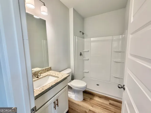 a view of a kitchen from the hallway