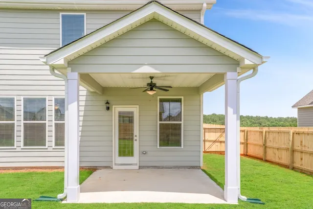 a sign that is sitting in front of flowers