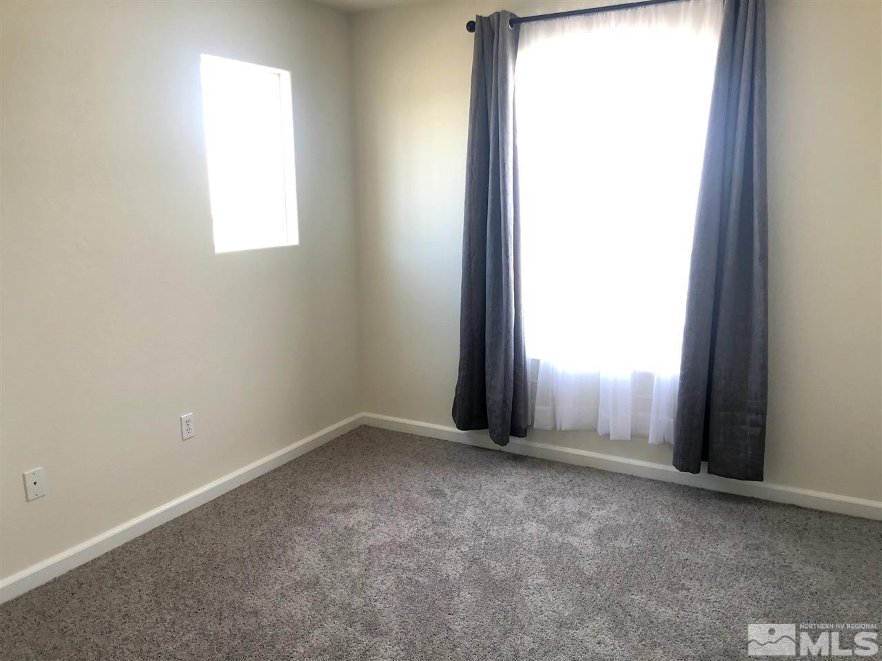 2288 Rio Lobo Lane Reno, NV 89521 - Photo 8 of 26 an empty room with a window