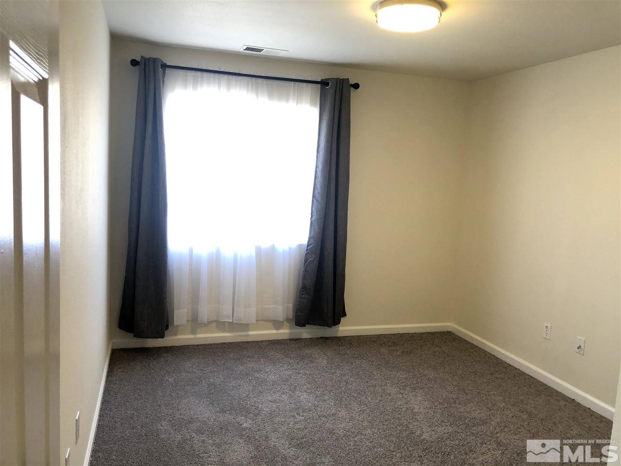 2288 Rio Lobo Lane Reno, NV 89521 - Photo 10 of 26 an empty room with a window