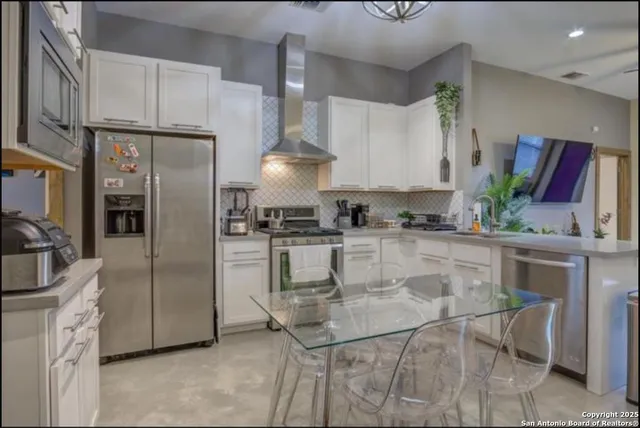 a bathroom with a sink a mirror and shower