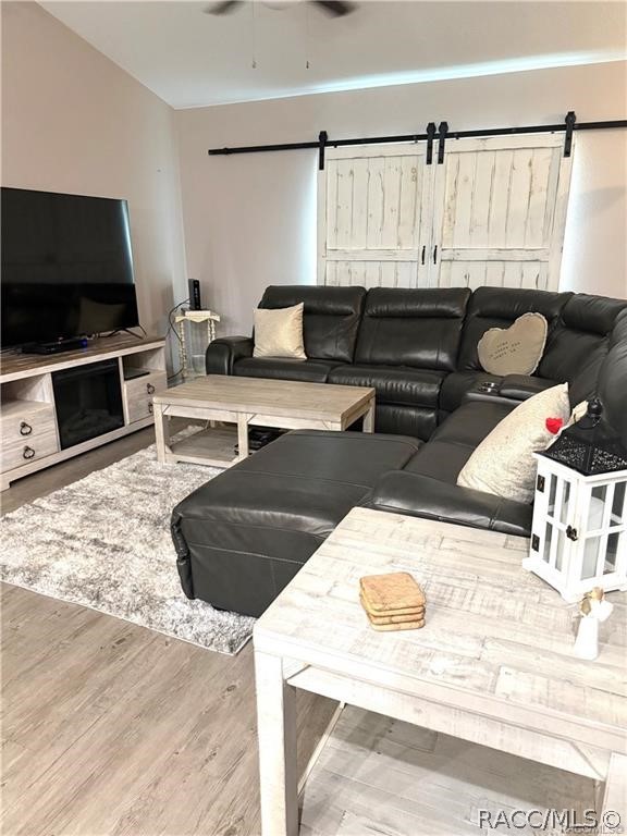 13591 Southwest 112th Street Dunnellon, FL 34432 - Photo 12 of 24 a living room with furniture and a flat screen tv