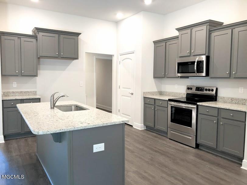 6227 Roxanne Way Biloxi, MS 39532 - Photo 2 of 33 Graphite grey cabinets and dallas white