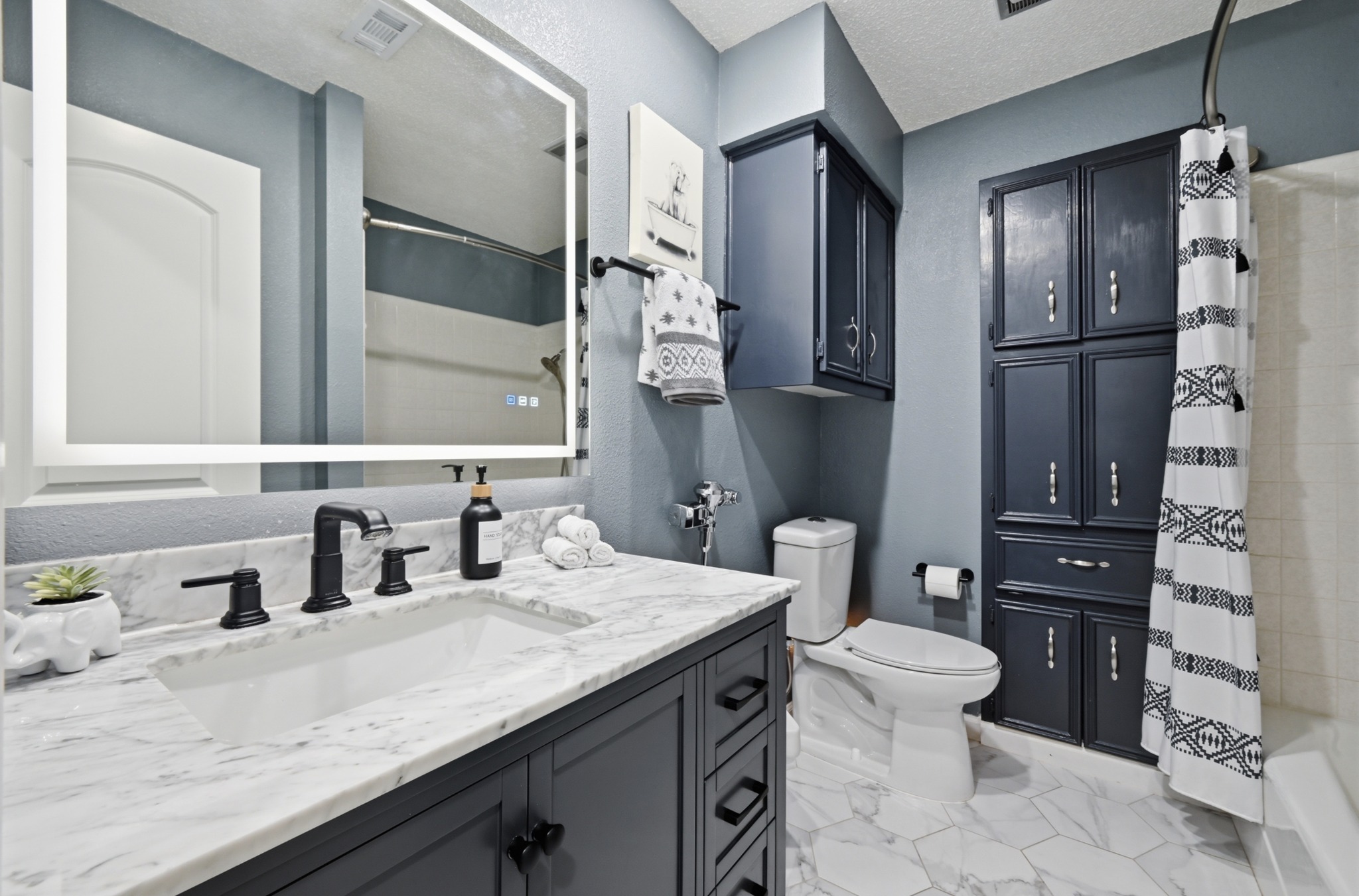 303 Pin Oak Drive Georgetown, TX 78628 - Photo 26 of 36 a bathroom with a granite countertop sink toilet and shower