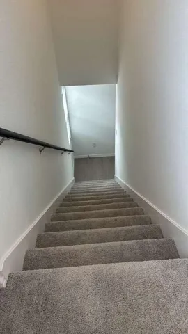 a view of kitchen with kitchen island microwave and stove