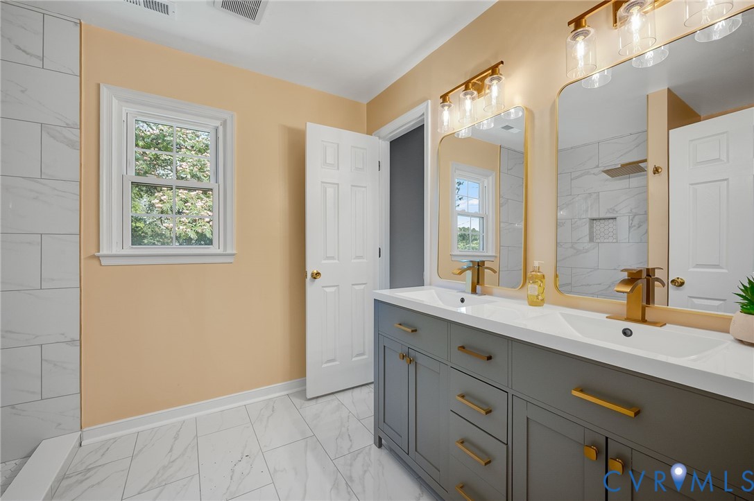 10110 Holly Road Mechanicsville, VA 23116 - Photo 23 of 26 Dual vanity featuring a white countertop, gold-fin