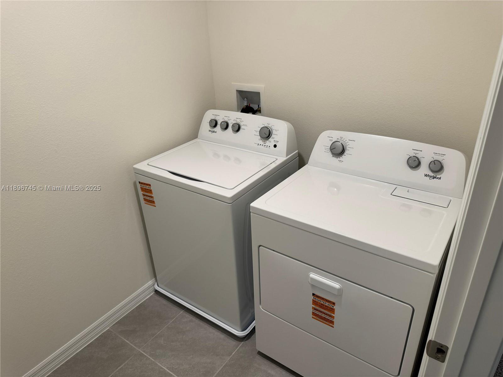 4251 Southwest 53rd Ln Road Ocala, FL 34474 - Photo 6 of 6 a utility room with dryer and washer