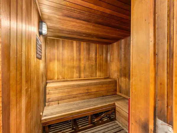 a view of a room with wooden walls