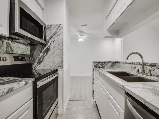 wooden floor in an empty room with a fireplace