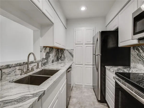 a kitchen with a stove and a microwave
