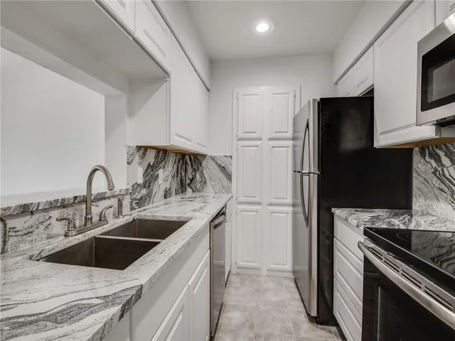 a kitchen with a stove and a microwave
