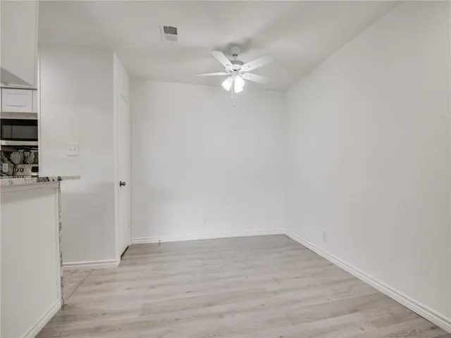 a kitchen with a sink stove and refrigerator