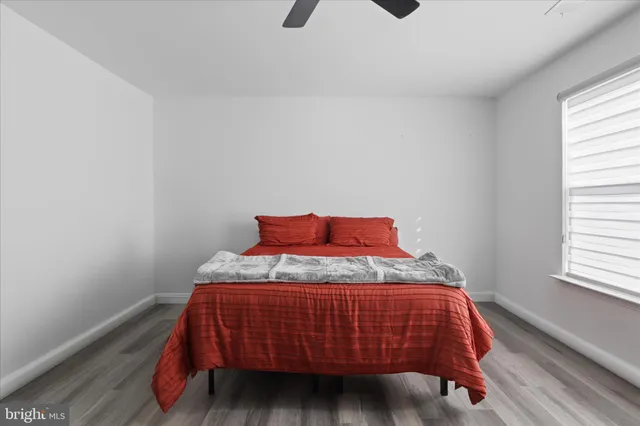 a bedroom with a bed and window