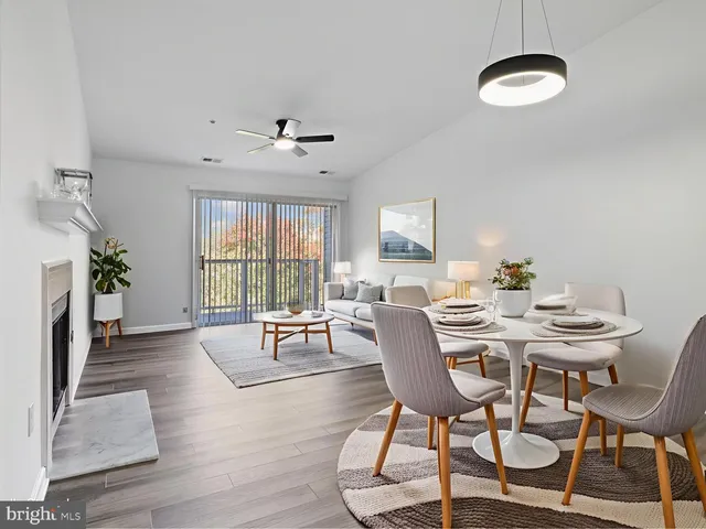 a view of a livingroom with furniture window and wooden floor