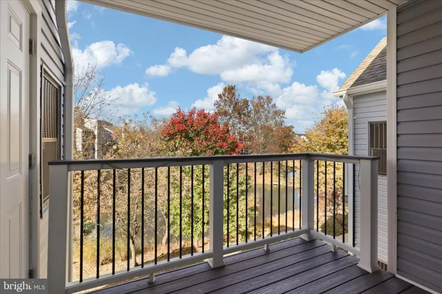 a view of a balcony with wooden floor