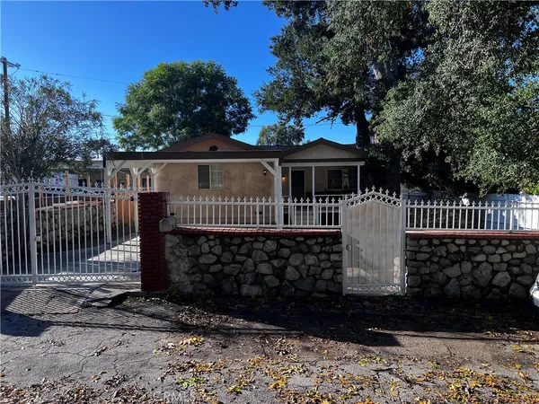 a view of house with a deck