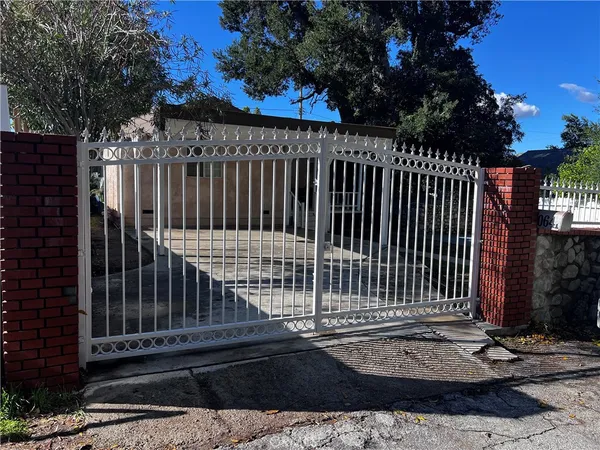 a view of a door with a fence