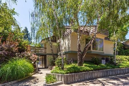 10120 United Place Cupertino, CA 95014 - Photo 20 of 30 a front view of a house with a garden