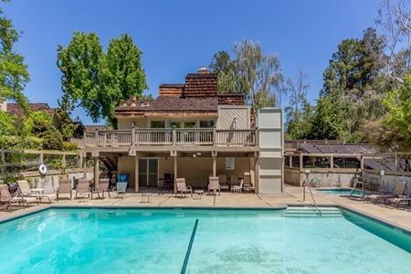 10120 United Place Cupertino, CA 95014 - Photo 22 of 30 a front view of a house with swimming pool having outdoor seating