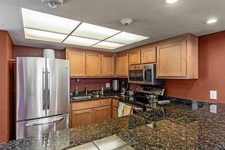 10120 United Place Cupertino, CA 95014 - Photo 24 of 30 a kitchen with stainless steel appliances granite countertop a refrigerator stove and sink