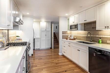10120 United Place Cupertino, CA 95014 - Photo 4 of 30 a kitchen with stainless steel appliances granite countertop a sink stove and refrigerator
