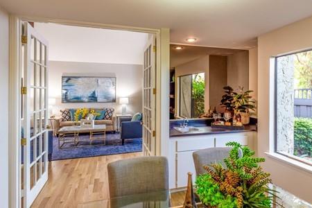 10120 United Place Cupertino, CA 95014 - Photo 7 of 30 a living room with furniture and a large window