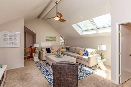 10120 United Place Cupertino, CA 95014 - Photo 8 of 30 a living room with furniture and a chandelier
