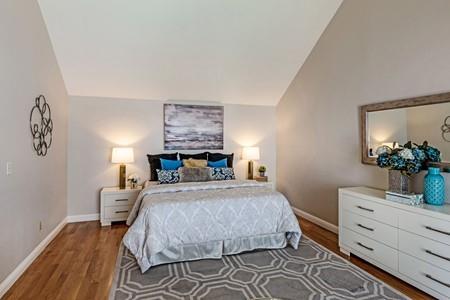 10120 United Place Cupertino, CA 95014 - Photo 10 of 30 a bedroom with a bed and a dresser in it